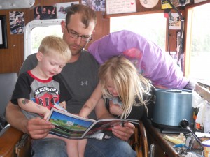 Teyen, age 2, is young for the deck yet, but likes joining his dad in the captain's seat.